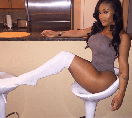 hot pic of lira galore in white high thighs sitting on a chair showing off her voluptuous curves